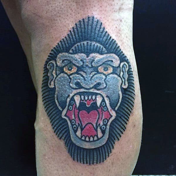 Guy With Traditional Blue Gorilla Design Tattoo On Bicep