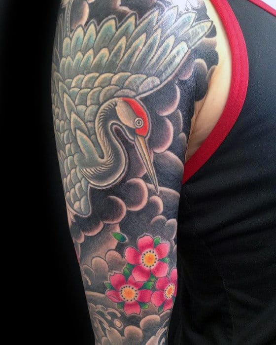 Guy With Traditional Japanese Crane Bird Clouds Sleeve Tattoo On Arm