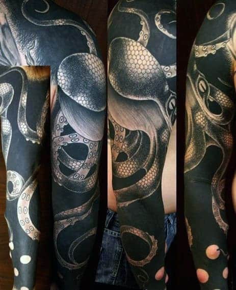 Full sleeve black and grey octopus tattoo with detailed tentacles on an arm