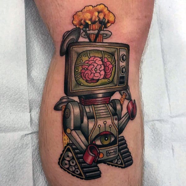 Tattoo of a robotic figure with a vintage TV head displaying a brain, an explosion bursting from the top, mechanical arms, and a single eye on its body.