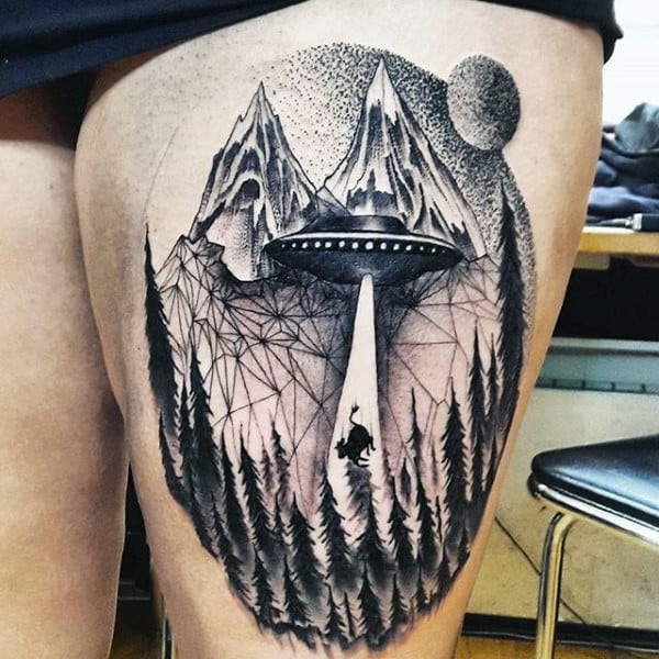 Guy With Ufo On Mountain Ranges And Cow Tattoo On Thigh
