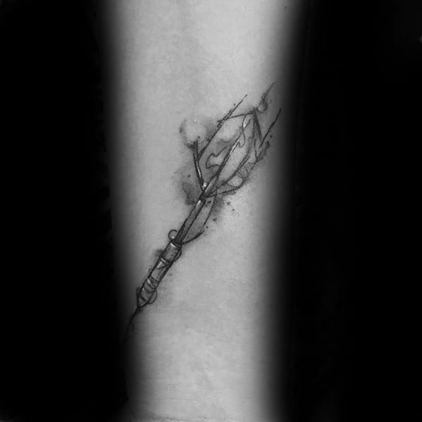 Fine line dart tattoo with abstract flame and smoke elements, symbolizing fiery passion and sharp focus.