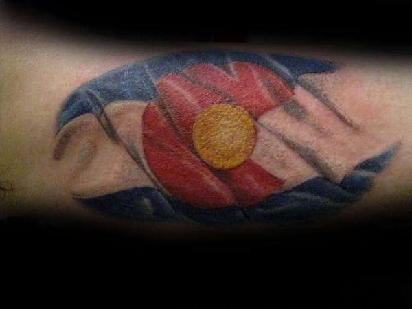 Guy With Waving Colorado Flag Tattoo On Arms