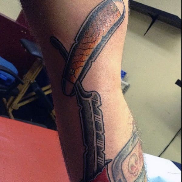 Guy With Wonderful Straight Razor Tattoo On Forearm