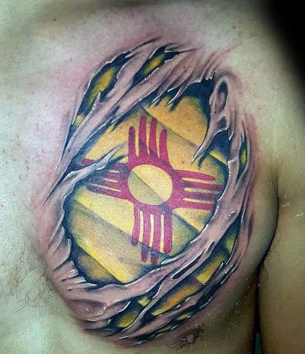 Guy With Zia Tattoo Design Ripped Skin Flag Chest