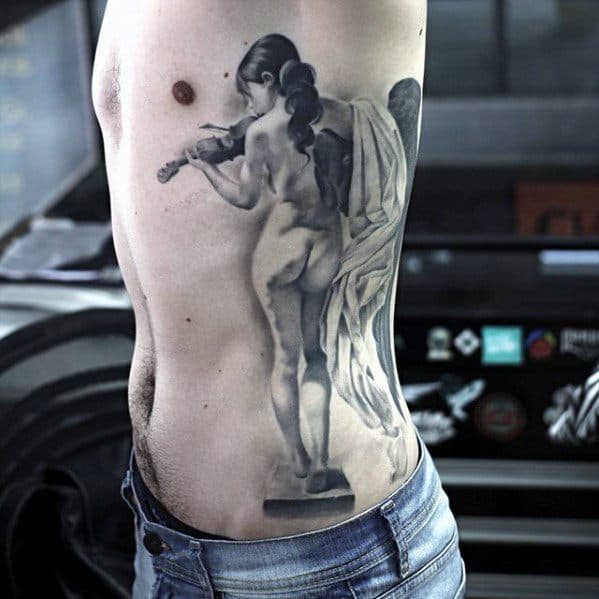 Hyper-realistic tattoo of a nude female statue playing the violin, inked on the side torso with soft shading and sculptural detail.