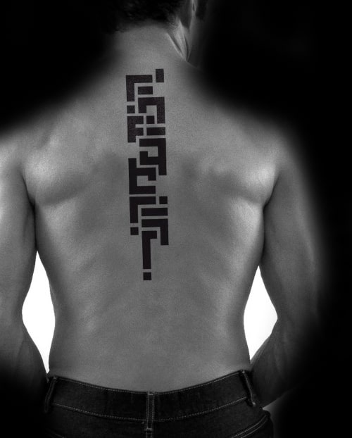 Black geometric tattoo design running down a man's bac