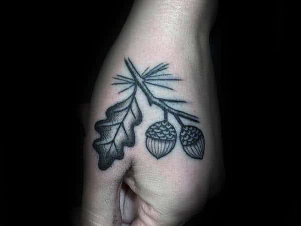 Guys Acorn Tattoo On Hand With Dotwork And Black Ink Design