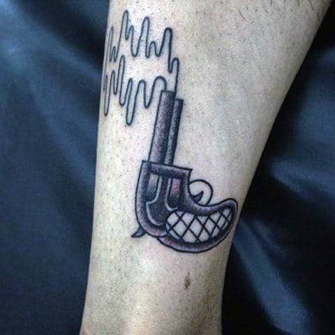 Guys Ankle Pistol With Squiggly Lines Tattoos