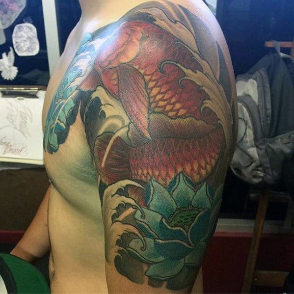 Guys Arowana Tattoo Designs Half Sleeve With Blue Lotus Flower