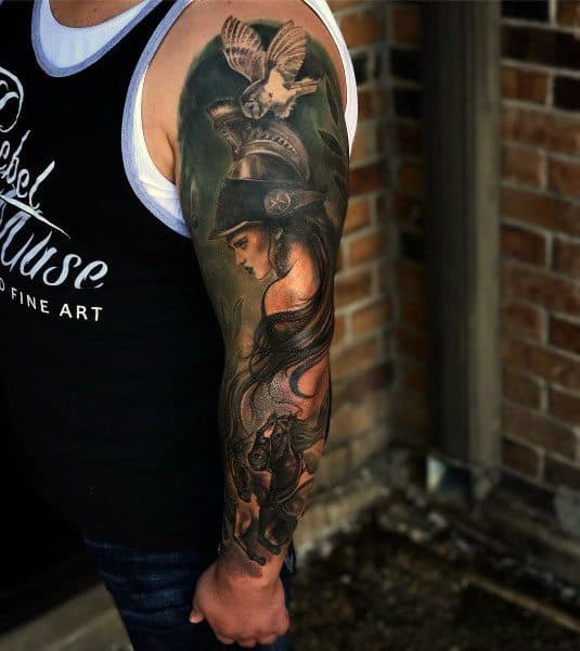 Full-color Athena sleeve tattoo with helmeted goddess, owl in flight, and mythological details in a rich, painterly realism style