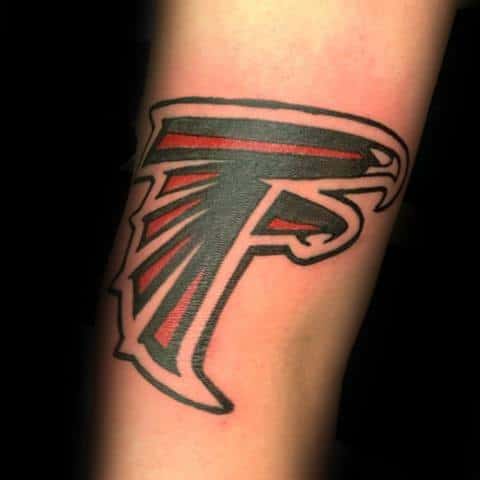 Clean Atlanta Falcons logo tattoo on the forearm, with bold black outlines and red accents for a sharp, dynamic look.