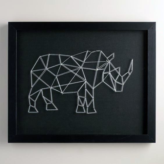Framed geometric rhino string art on a black canvas background.