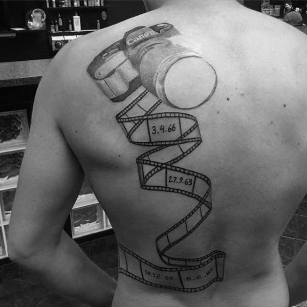 Guys Back Camera And Film Reel Tattoo