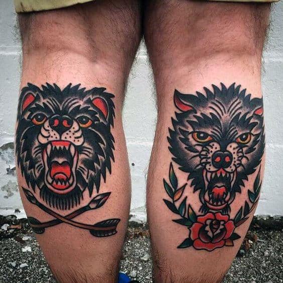 Guys Back Of Leg Calf Traditional Tattoo Of Bear And Wolf