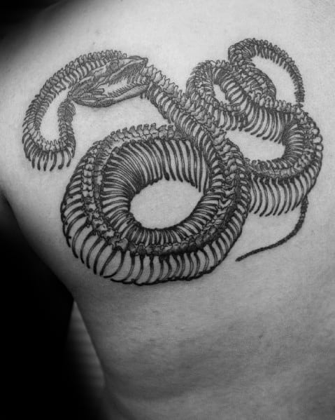 Snake skeleton tattoo on the upper back, featuring intricate bone details and a coiled design for a bold and striking visual effect.