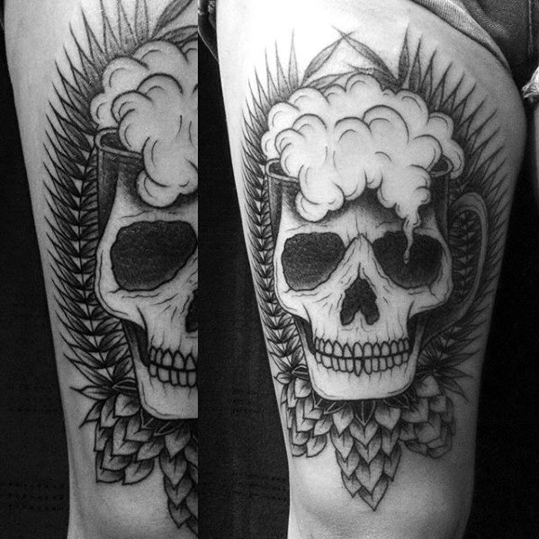 Black and gray tattoo of a beer mug forming a skull with foam as hair, surrounded by hop cones and barley leaves for a dark, beer-themed design.