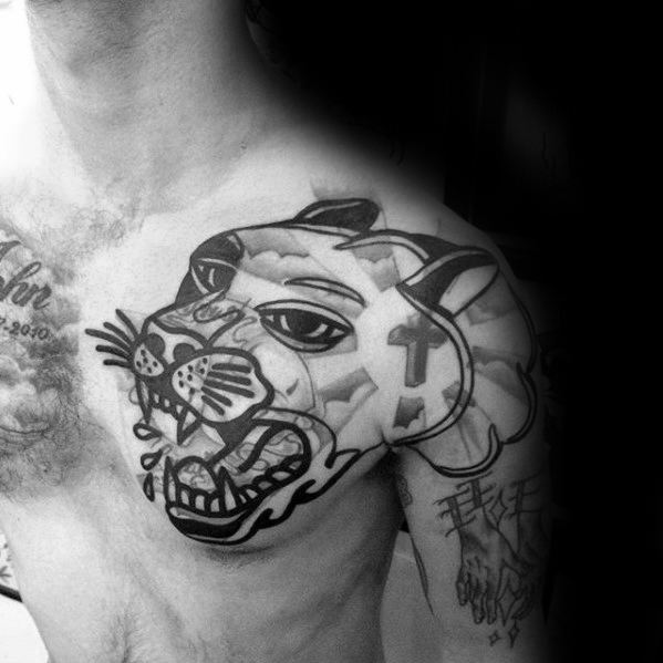 Close-up of a chest tattoo featuring a stylized roaring panther with blast over elements