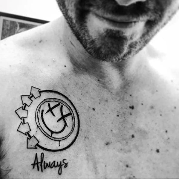Black and white tattoo of the Blink-182 smiley face logo with arrows, accompanied by the word "Always" in a clean, simple script below it.
