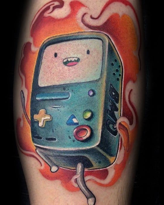 Adventure Time tattoo of BMO in vibrant colors with a fiery red-orange background, inked on the lower leg.