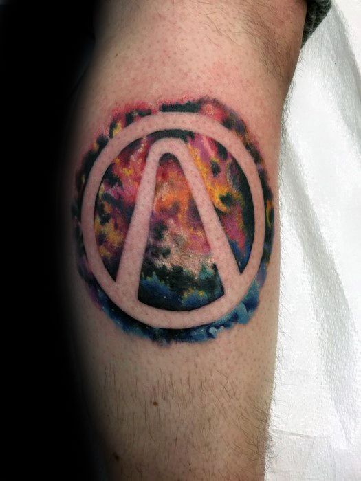 Borderlands logo tattoo with a vivid galaxy-themed background, blending vibrant shades of red, purple, orange, and blue.