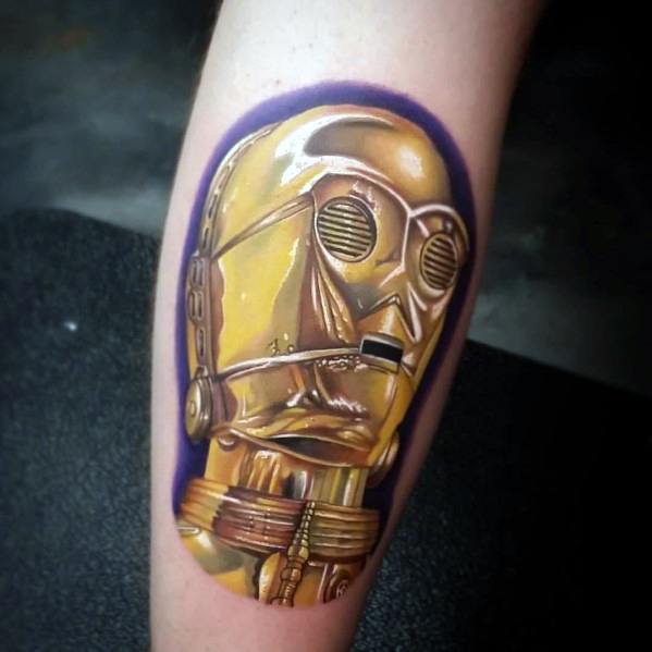 Hyper-realistic C-3PO tattoo with reflective gold detailing and a bold purple outline, creating a striking 3D effect on the skin.