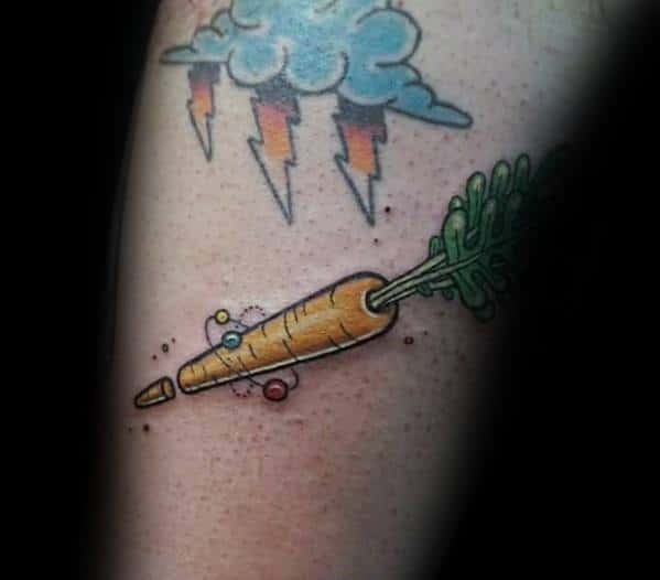 Playful cartoon-style carrot tattoo with a space-inspired design, featuring bright colors, orbiting planets, and a broken tip for a fun look.