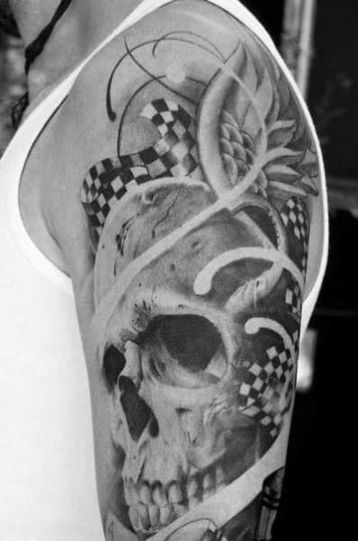 Realistic skull tattoo with flowing checkered flags and ornamental details, symbolizing racing passion, mortality, and the thrill of speed.