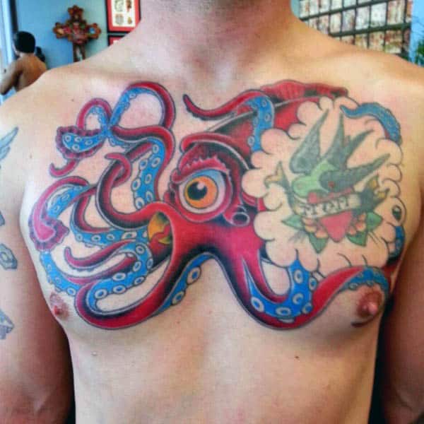 Guys Chest Squid Tattoo In Red Ink With Blue Tentacles