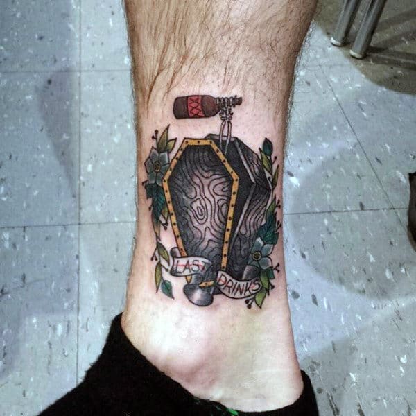 Guys Coffin Tattoo On Leg With Skeleon Hand Holding Beer