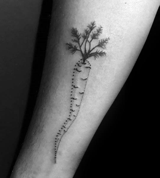 Minimalist dotwork carrot tattoo on the forearm, featuring fine stippling and delicate leafy details for a subtle yet artistic organic design.