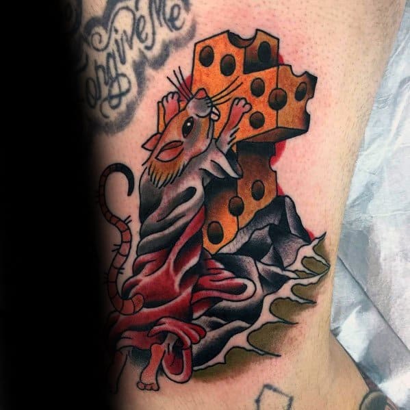 Colorful tattoo of a regal rat in a flowing red robe holding a large wedge of cheese, featuring bold outlines, rich shading, and a dramatic pose.