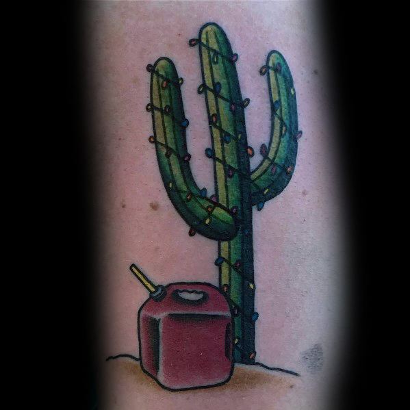 Christmas tattoo of a cactus wrapped in colorful holiday lights, with a gas can beside it, blending festive cheer with a desert-inspired and edgy design.