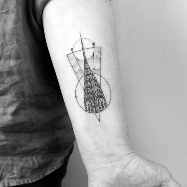 Geometric Chrysler Building tattoo with fine linework and abstract shapes, blending architectural detail with modern artistic elements.