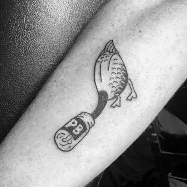 Black and gray tattoo of a goose with its head replaced by a peanut butter jar labeled "PB," inked in a minimalist and humorous style on the forearm.