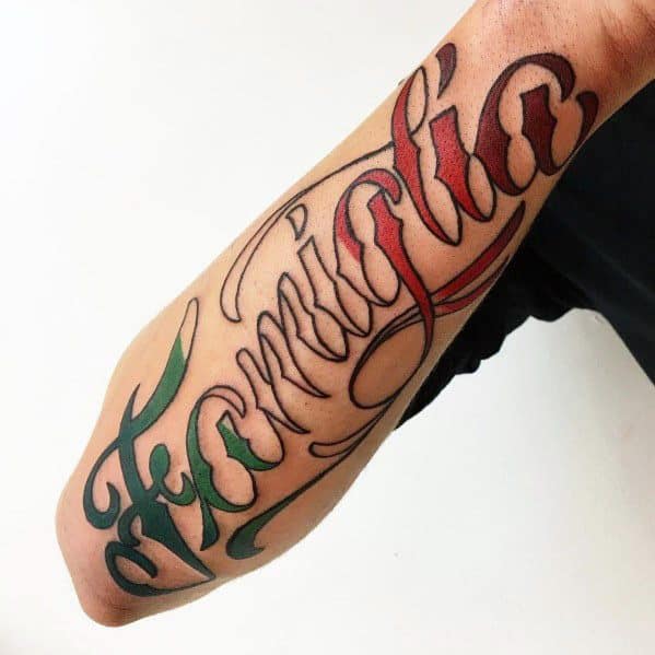 Forearm tattoo with "Famiglia" in elegant script, accented with Italian flag colors, symbolizing the importance of family and heritage.