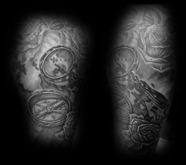 Tattoo featuring a magnifying glass over a world map, a compass, and roses, designed with deep shading for a bold and adventurous look.