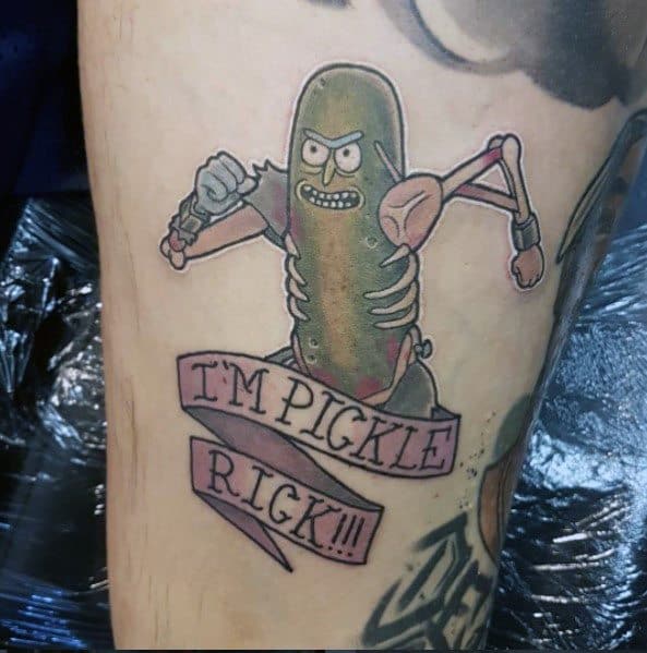 Pickle Rick tattoo with a cyborg body and a pink banner reading 'I'm Pickle Rick!!!', featuring bold lines and vibrant shading on the leg.