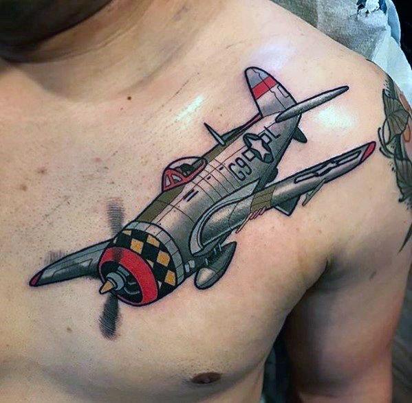 Colorful chest tattoo of a WWII-era fighter plane with a checkered nose, detailed shading, and bold outlines for a dynamic aviation design.