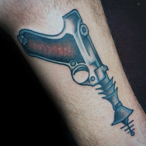 Black and grey ray gun tattoo with a futuristic design, featuring bold shading, a sleek grip, and a sharp, mechanical muzzle detail.