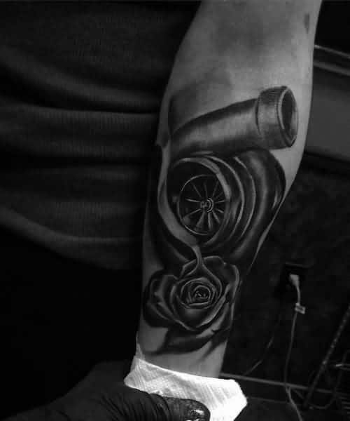 Realistic turbocharger and rose tattoo on the forearm with fine shading, blending mechanical power with delicate floral elements for a unique design.