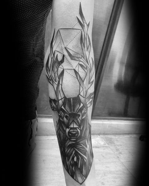 Geometric black and grey elk tattoo on the forearm, featuring intricate shading, angular antlers, and abstract patterns for a bold modern design.