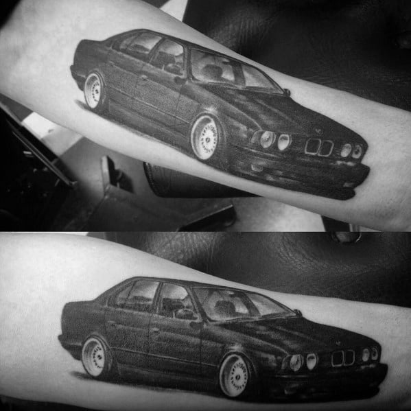 Realistic BMW E34 tattoo on forearm, featuring fine details and bold shading for a sleek and classic automotive-inspired design.