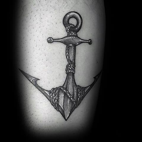Realistic black and gray anchor tattoo with intricate shading and rope details, symbolizing strength, stability, and a deep connection to the sea.