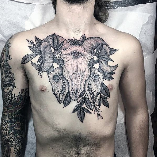 Guys Detailed Goat Skulls Chest Tattoo With Black And Grey Ink Design