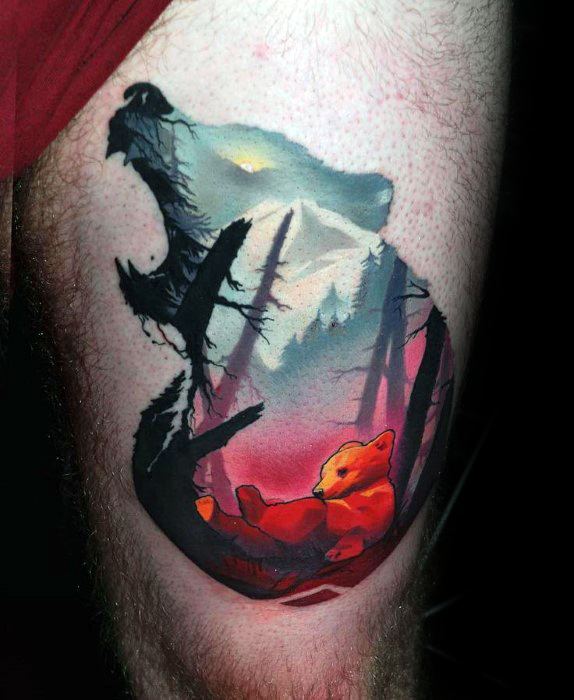 Vibrant tattoo of a bear silhouette filled with a forest scene and a glowing orange cub resting under sunset skies, blending warmth and wilderness.