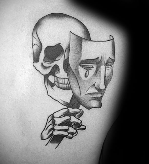 Guys Drama Mask Tattoo Deisgns With Skull And Skeleton Hand On Upper Back Shoulder Blade