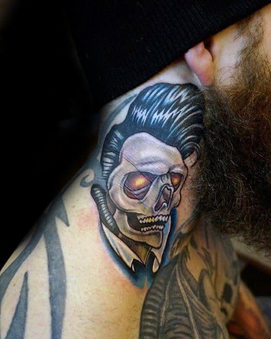Neo-traditional Elvis Presley skull tattoo on the neck, featuring glowing red eyes, sharp shadows, and his iconic slick hairstyle.
