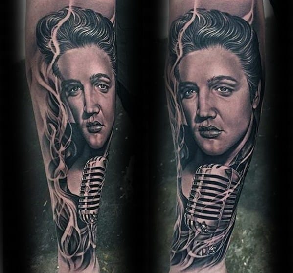Hyper-realistic Elvis Presley forearm tattoo featuring a vintage microphone and smoky details wrapping around his portrait.