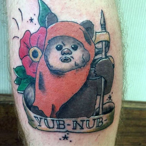 Traditional-style Ewok tattoo with a red hood, flower accent, and a banner reading Yub-Nub, holding a spear with a sweet expression.